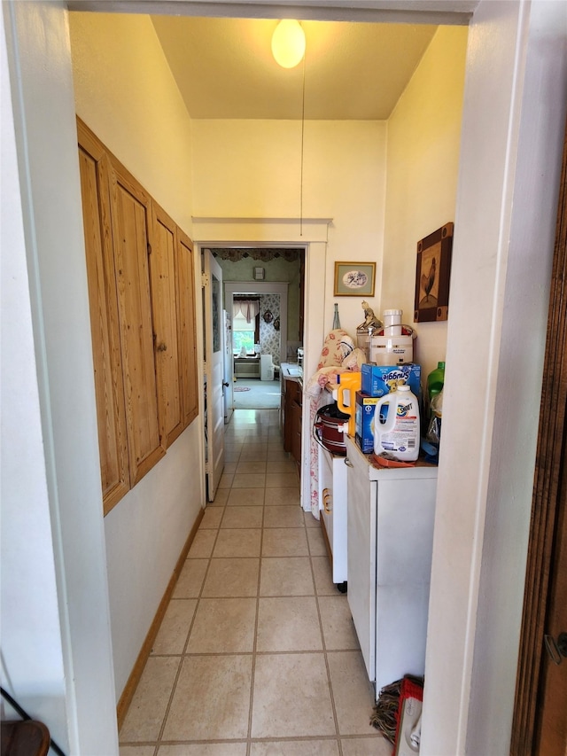 hall with light tile patterned flooring