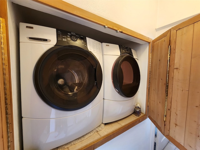 clothes washing area featuring independent washer and dryer