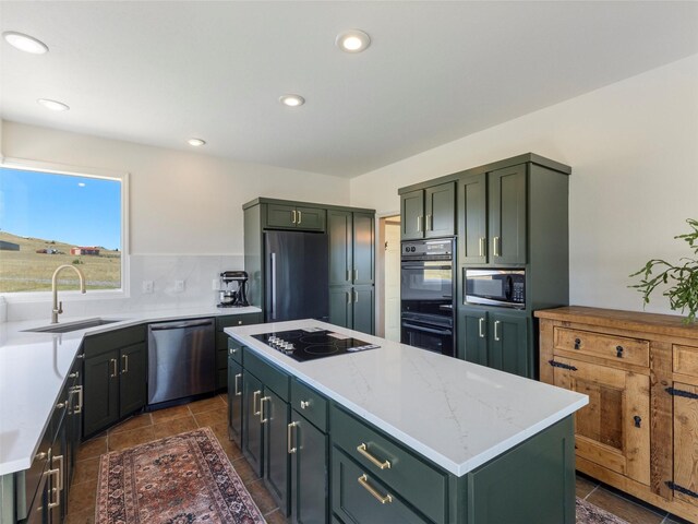 kitchen with a kitchen island, tasteful backsplash, light stone countertops, dark tile patterned flooring, and black appliances