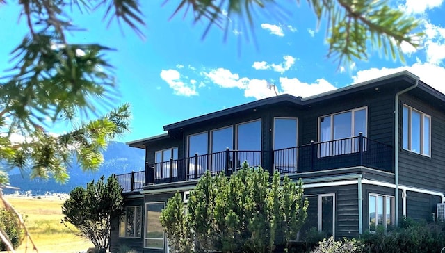 view of property exterior with a balcony