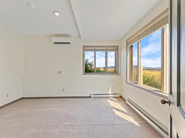 unfurnished room with a baseboard radiator, light carpet, and a wall unit AC