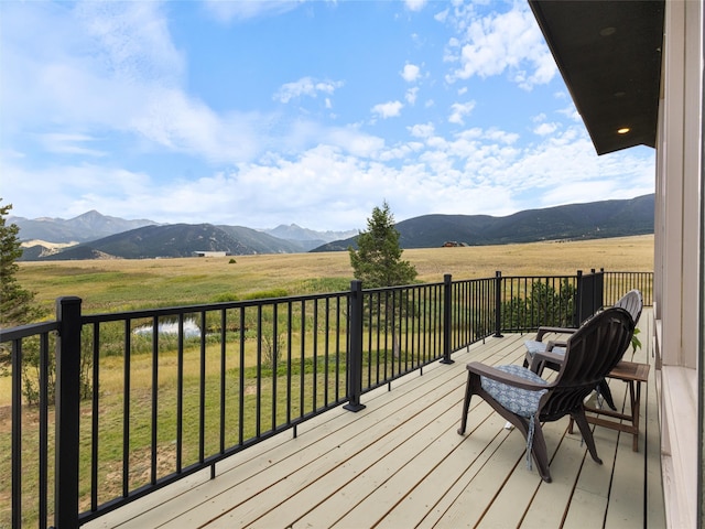 deck with a mountain view and a rural view