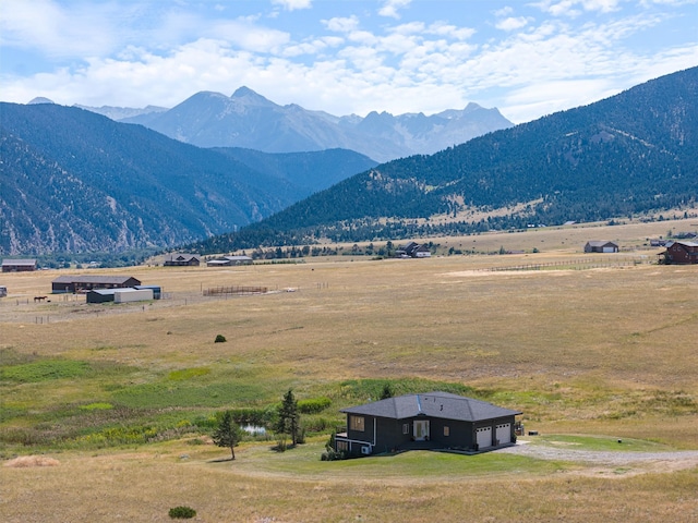 mountain view featuring a rural view