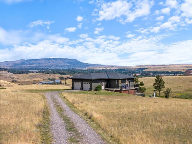 mountain view featuring a rural view