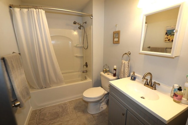 bathroom with vanity, tile patterned flooring, shower / bath combo with shower curtain, and toilet