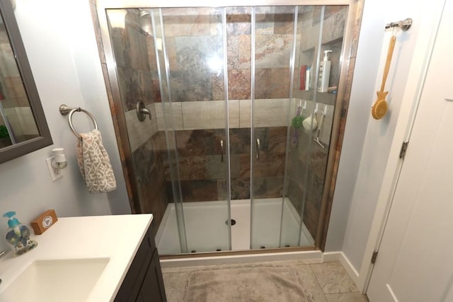 full bath featuring a shower stall and vanity