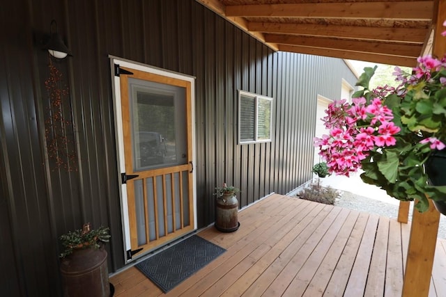 wooden terrace featuring visible vents