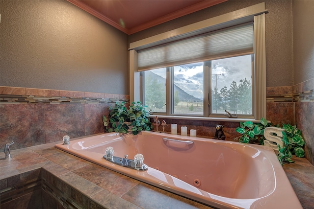 bathroom featuring tiled tub, tile walls, and ornamental molding