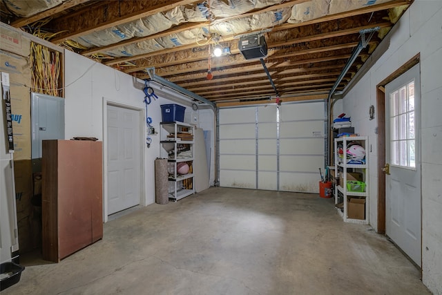 garage featuring a garage door opener and electric panel