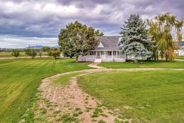 exterior space featuring a front lawn and a porch