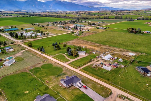 drone / aerial view featuring a mountain view and a rural view