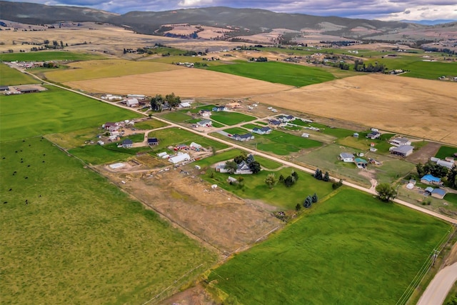 birds eye view of property featuring a mountain view and a rural view