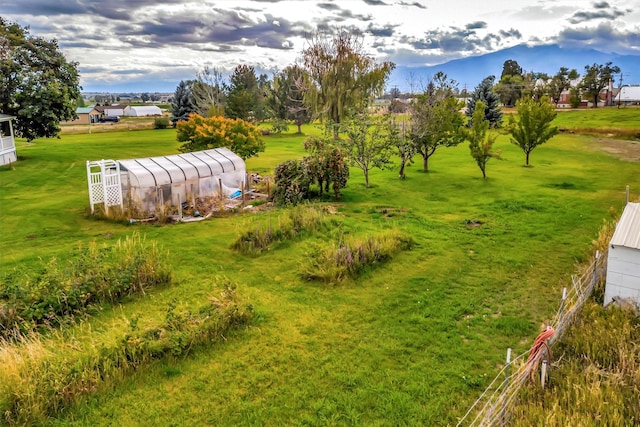 exterior space with an outbuilding and a lawn