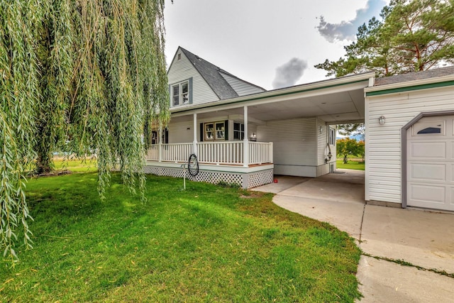 view of front of property with a carport, covered porch, and a front yard