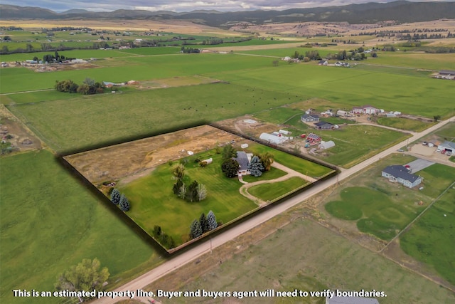 bird's eye view with a mountain view and a rural view