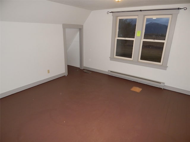 bonus room featuring vaulted ceiling and a baseboard heating unit