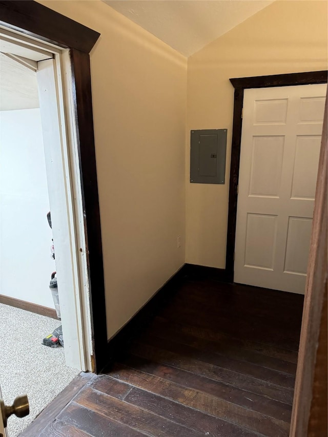 corridor featuring dark hardwood / wood-style floors and electric panel