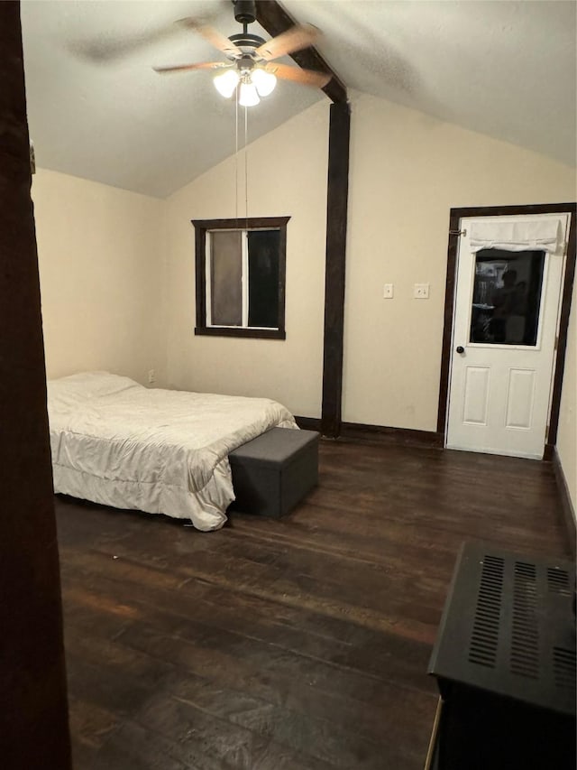 bedroom featuring lofted ceiling, dark hardwood / wood-style floors, and ceiling fan