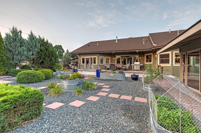 back of house with a patio area