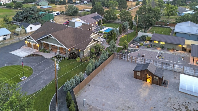 birds eye view of property with a residential view