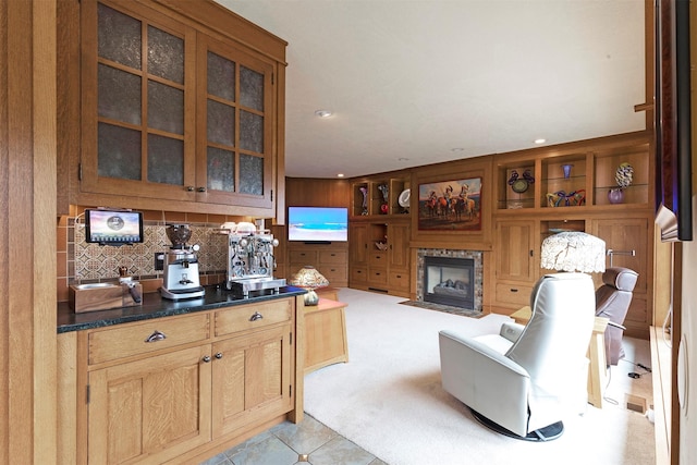 interior space featuring light carpet, light tile patterned flooring, and a fireplace with flush hearth