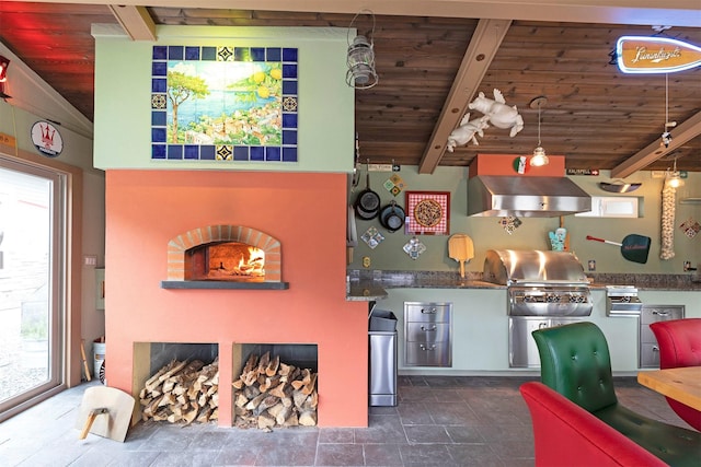 interior space with stone finish floor, wooden ceiling, exhaust hood, and beam ceiling