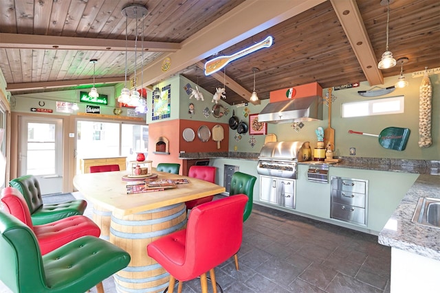 kitchen featuring vaulted ceiling with beams, a sink, exhaust hood, wood ceiling, and pendant lighting