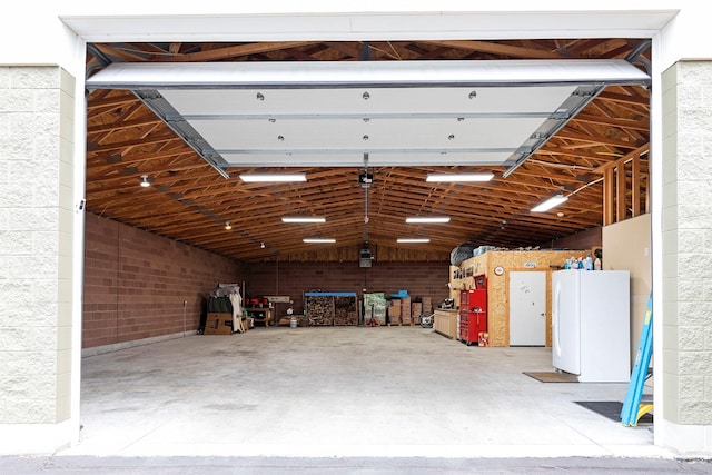 garage with freestanding refrigerator