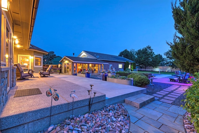 view of patio / terrace with fence and a pool