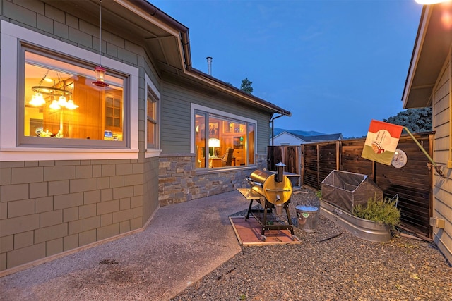 view of patio featuring fence and grilling area