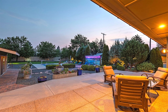 view of patio / terrace featuring fence