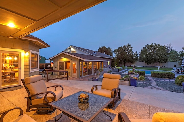 view of patio / terrace featuring an outbuilding, an exterior structure, and fence