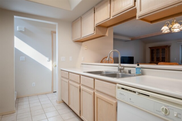 kitchen featuring light tile patterned flooring, sink, a chandelier, light brown cabinets, and dishwasher