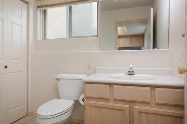 bathroom featuring toilet and vanity