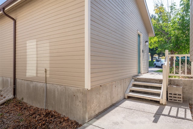 view of side of home with a patio area