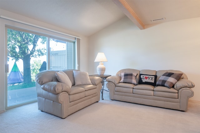 carpeted living room with vaulted ceiling with beams