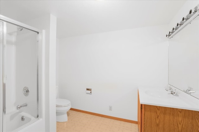 full bath with toilet, bath / shower combo with glass door, vanity, baseboards, and tile patterned floors