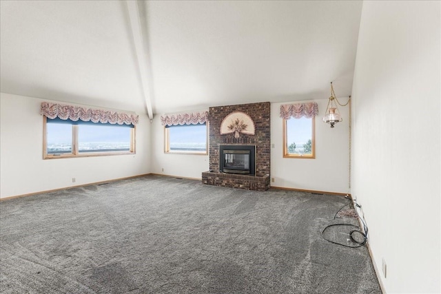 unfurnished living room with carpet floors, a healthy amount of sunlight, a fireplace, and baseboards