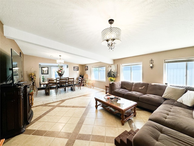 living area featuring a textured ceiling, light tile patterned floors, baseboards, a chandelier, and vaulted ceiling