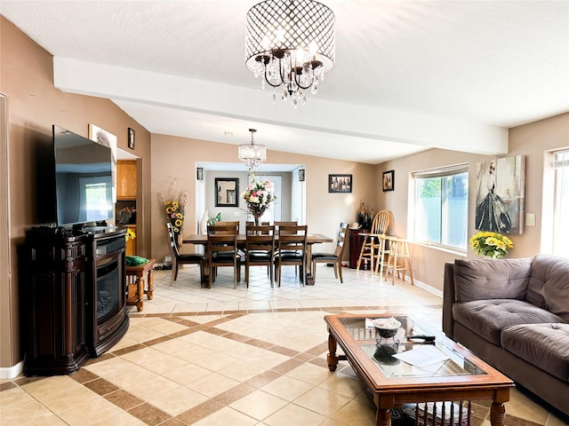 living area featuring baseboards, a notable chandelier, light tile patterned flooring, and vaulted ceiling