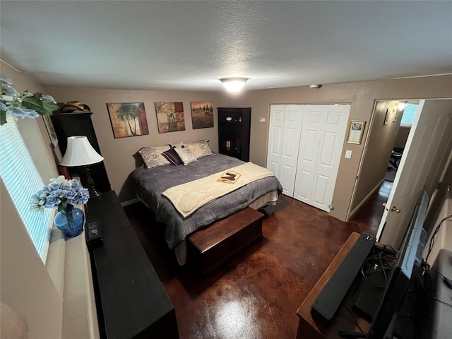 bedroom featuring a closet and a textured ceiling