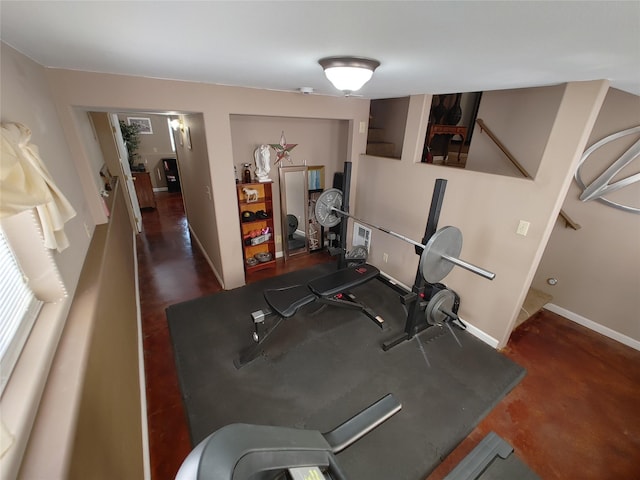 workout area featuring baseboards