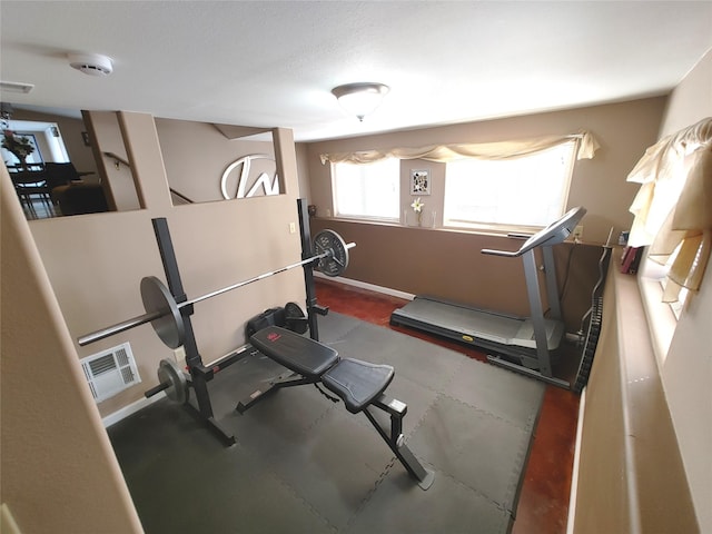 workout area featuring visible vents and baseboards