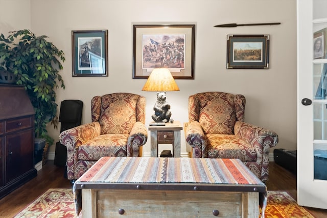 living area with hardwood / wood-style floors