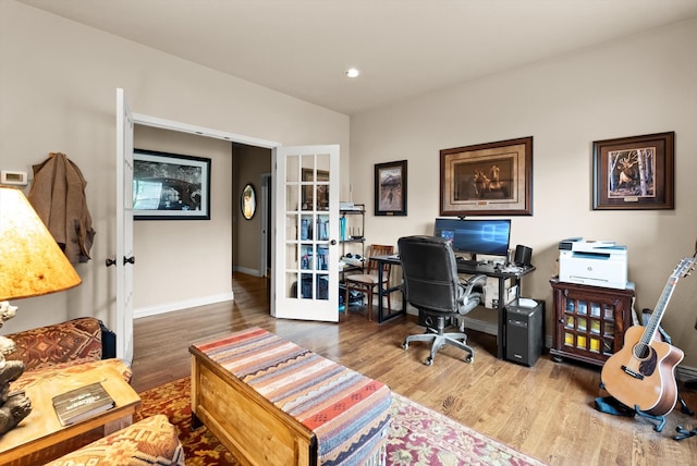 office space with french doors and wood-type flooring