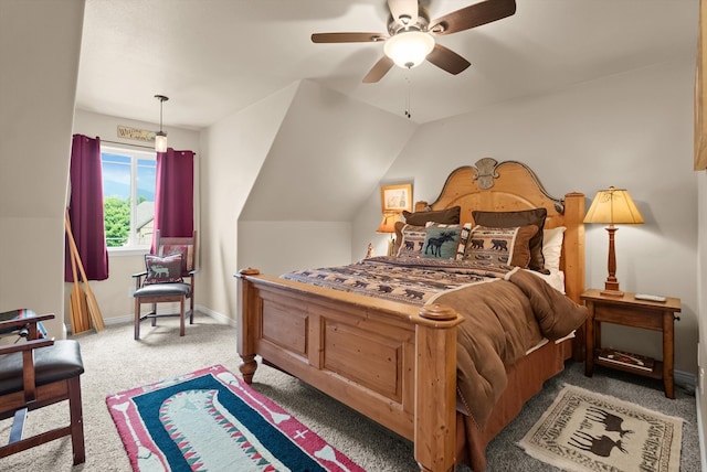 carpeted bedroom with ceiling fan and lofted ceiling