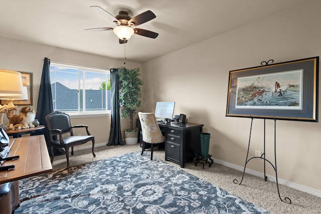 office space featuring ceiling fan and light carpet