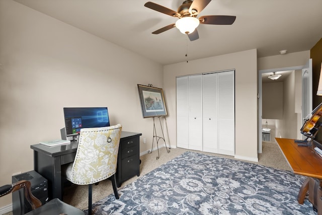 carpeted bedroom with a closet and ceiling fan