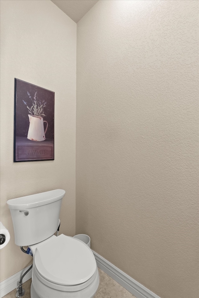 bathroom with tile patterned floors and toilet