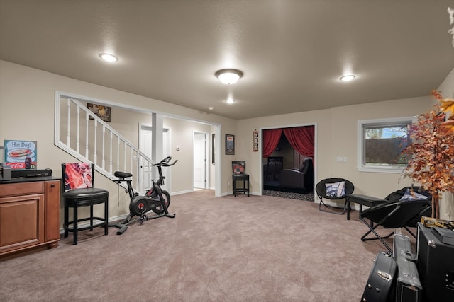 exercise room with light carpet